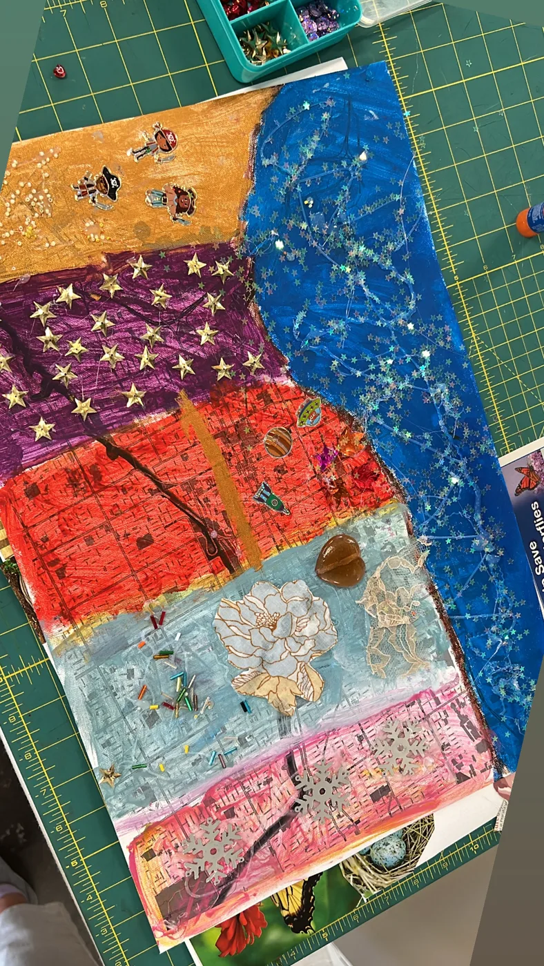 Painted map collage with stars and snowflakes