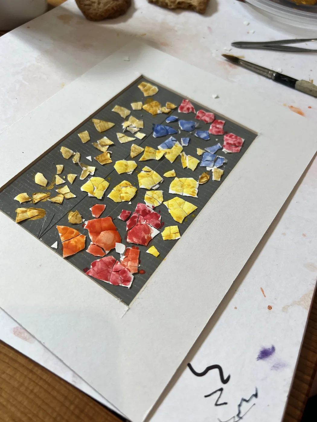 Eggshell mosaic in yellow, red and blue pieces