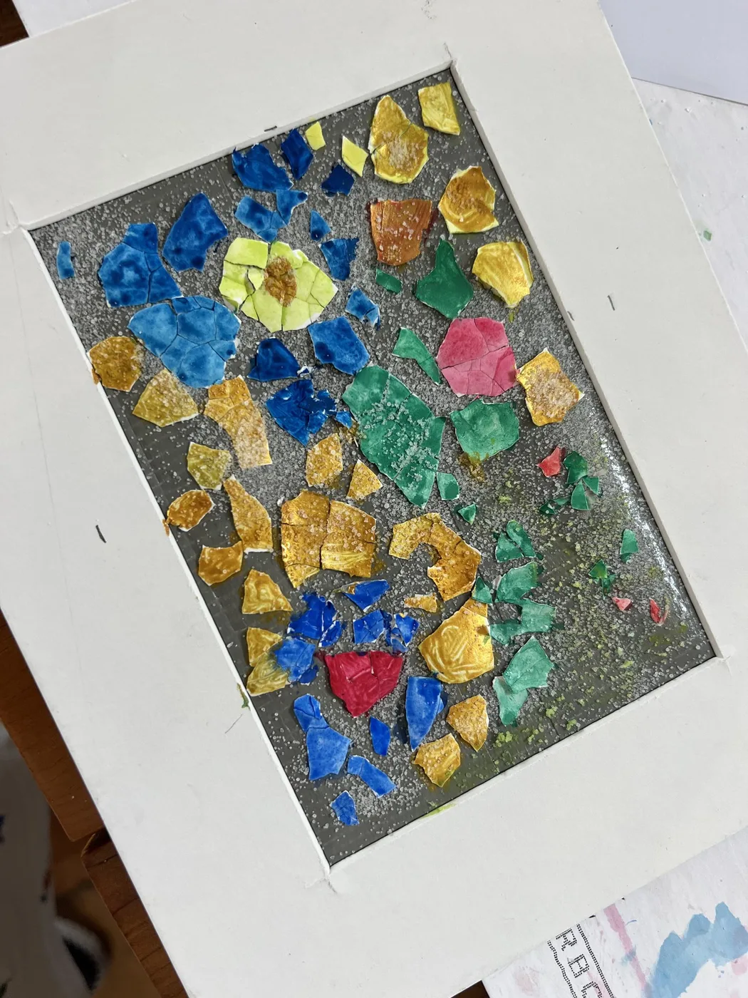 Eggshell mosaic of blue and yellow flowers