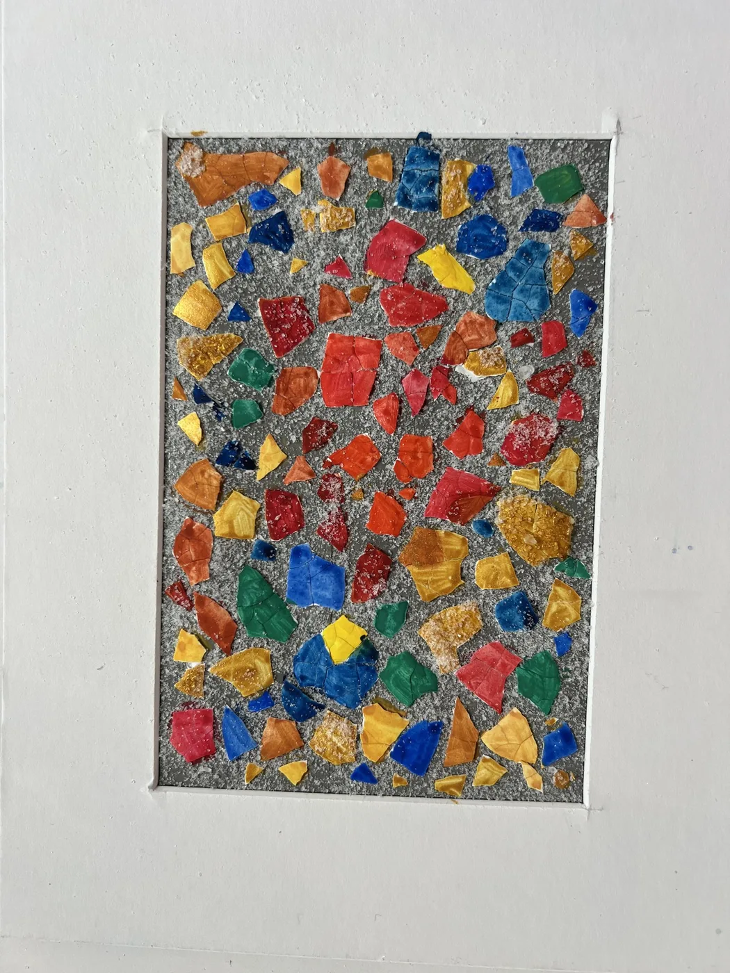 Eggshell mosaic of red, gold and blue pieces