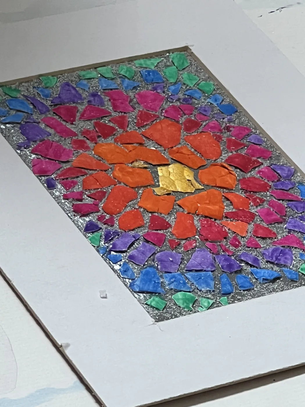 Eggshell mosaic radiating rainbow colours