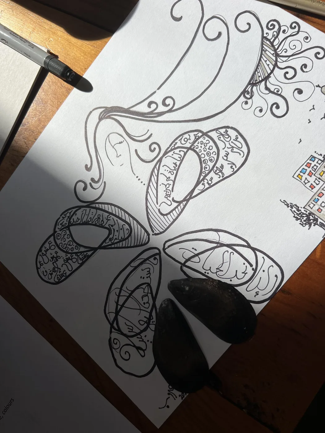 Ink shell-wings drawing filled with Arabic script and swirls
