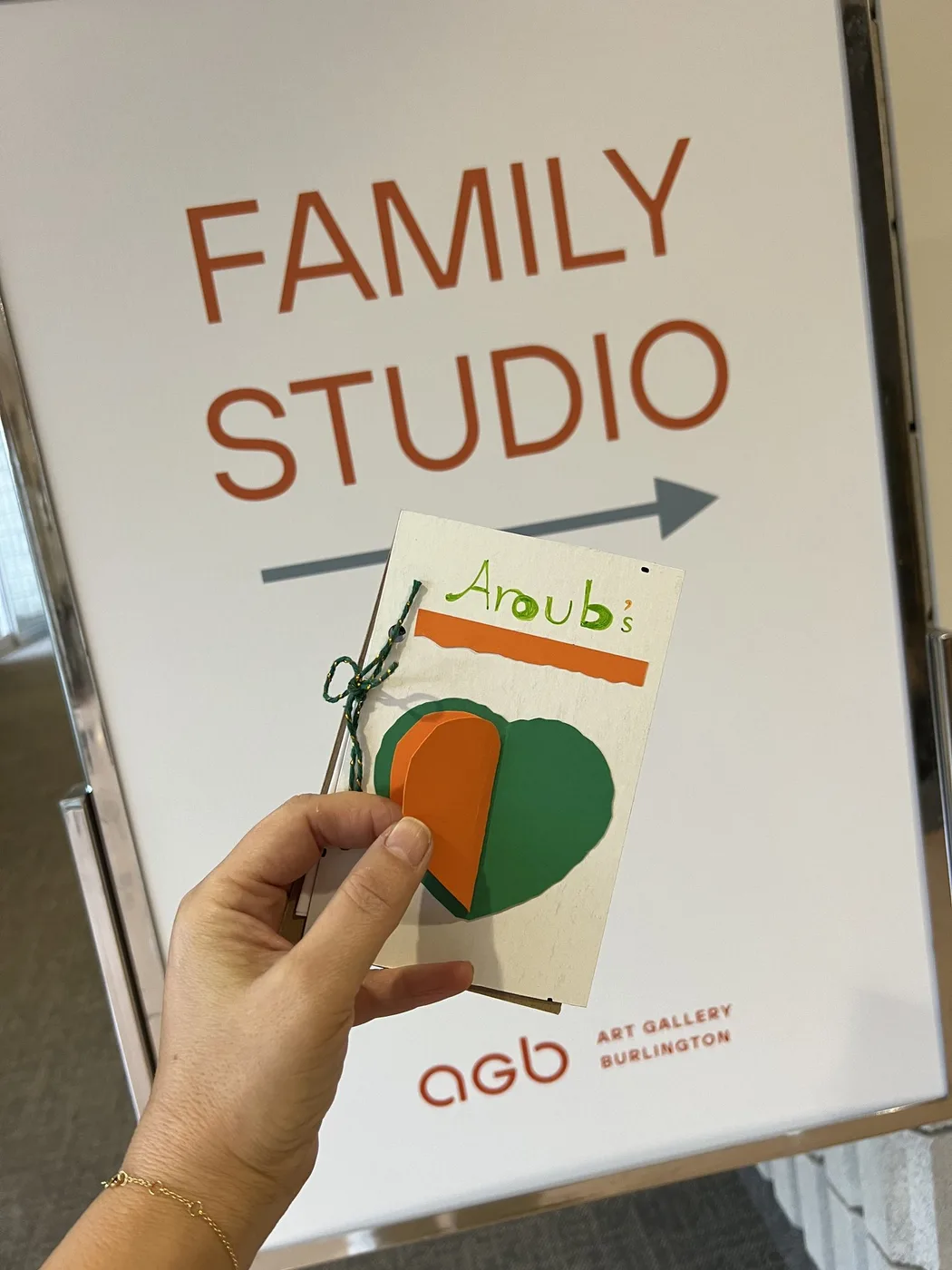 Wish book marked Aroub’s at the Family Studio sign