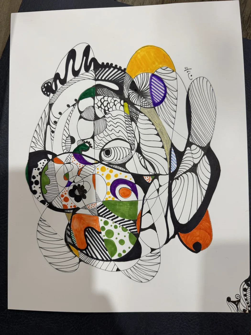 Black ink doodle with orange and purple accents