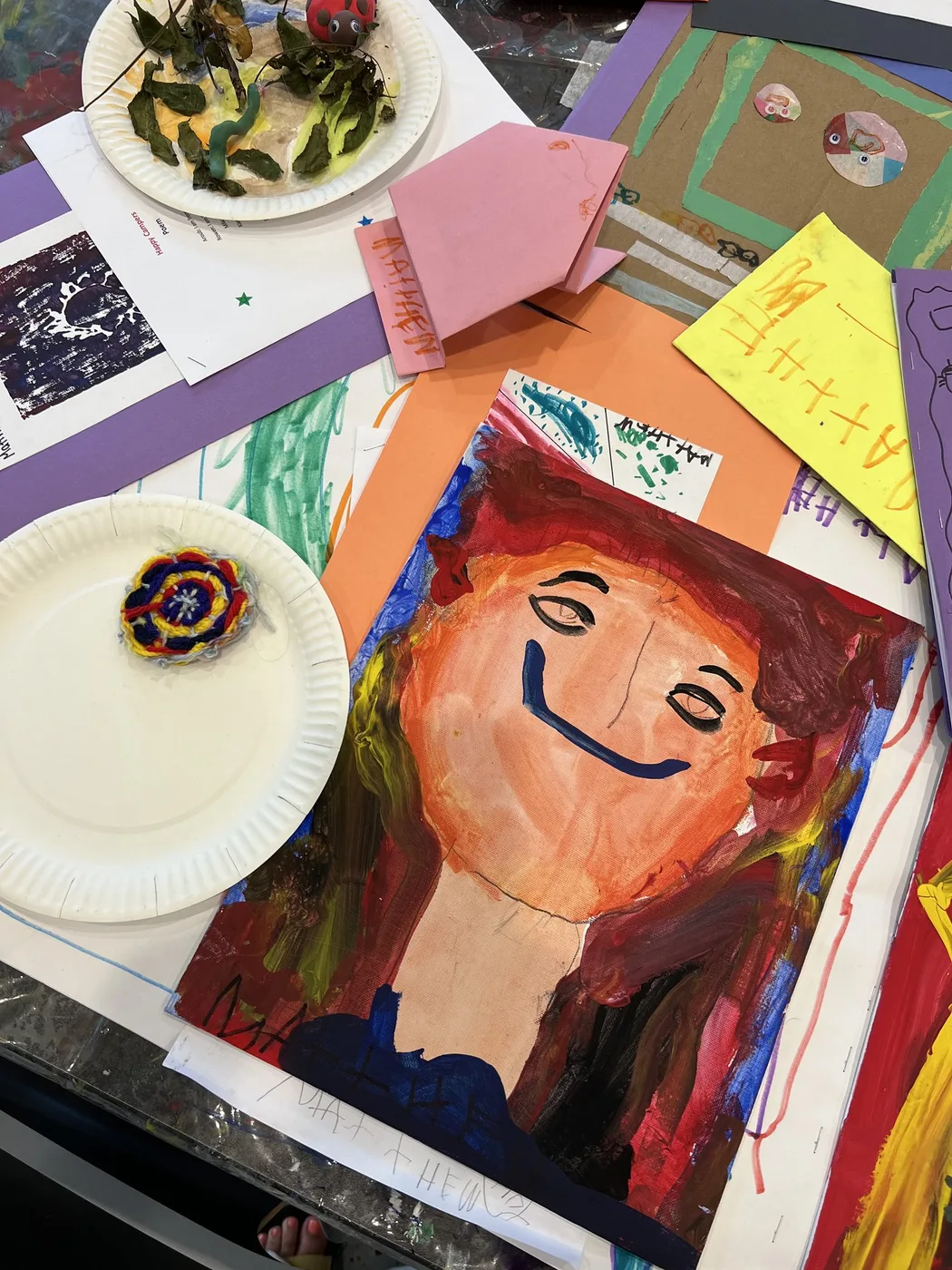 Camp portfolio with smiling painted portrait