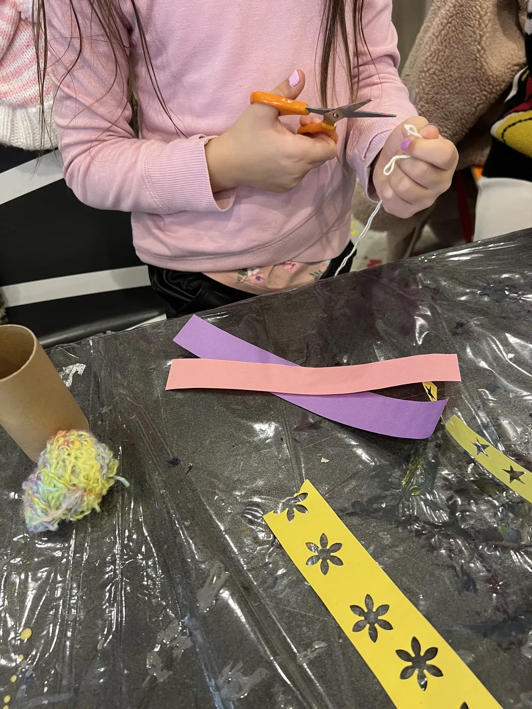 Cutting paper strips for a tube doll