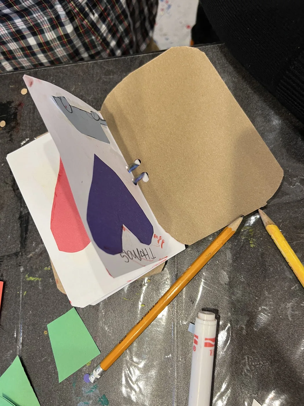 Open handmade book with paper hearts