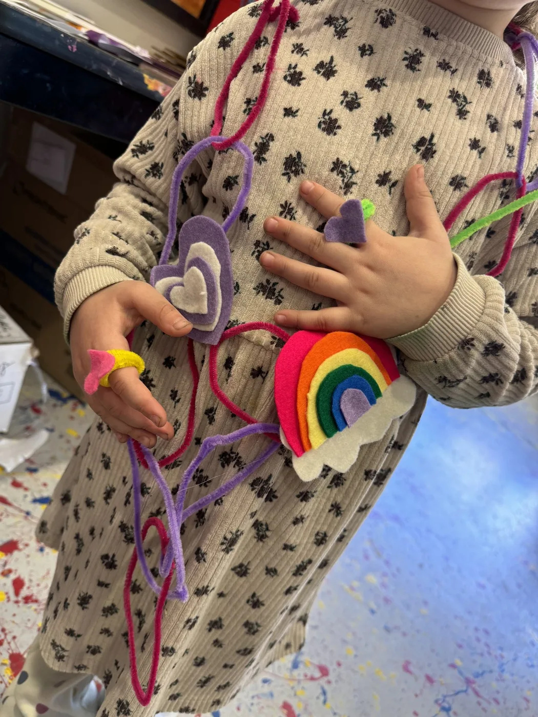 Pipe-cleaner necklace with felt hearts and rainbow