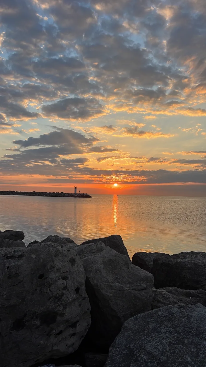 Sunset colour over rocks and water