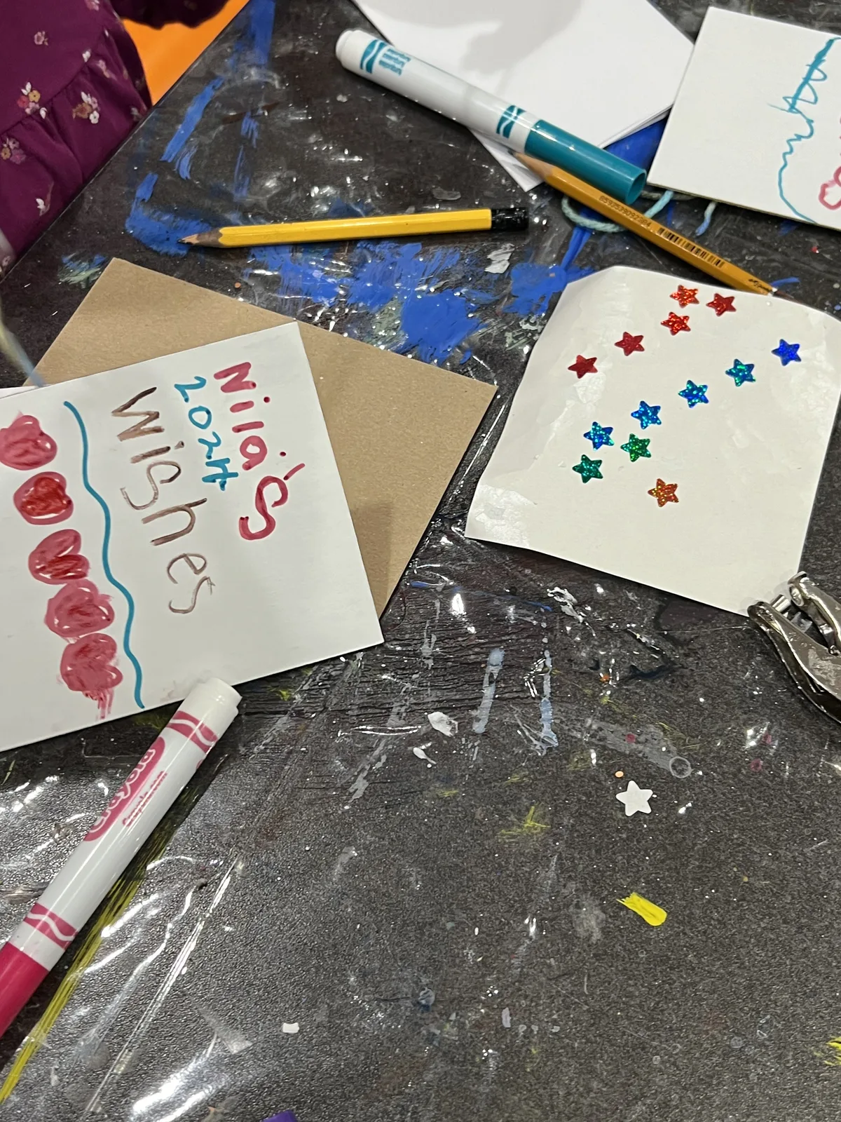 Handmade wish cards decorated with stars and hearts
