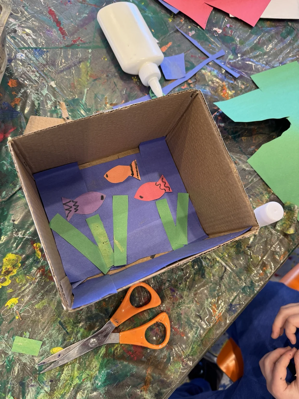 A fish scene made from a cardboard box