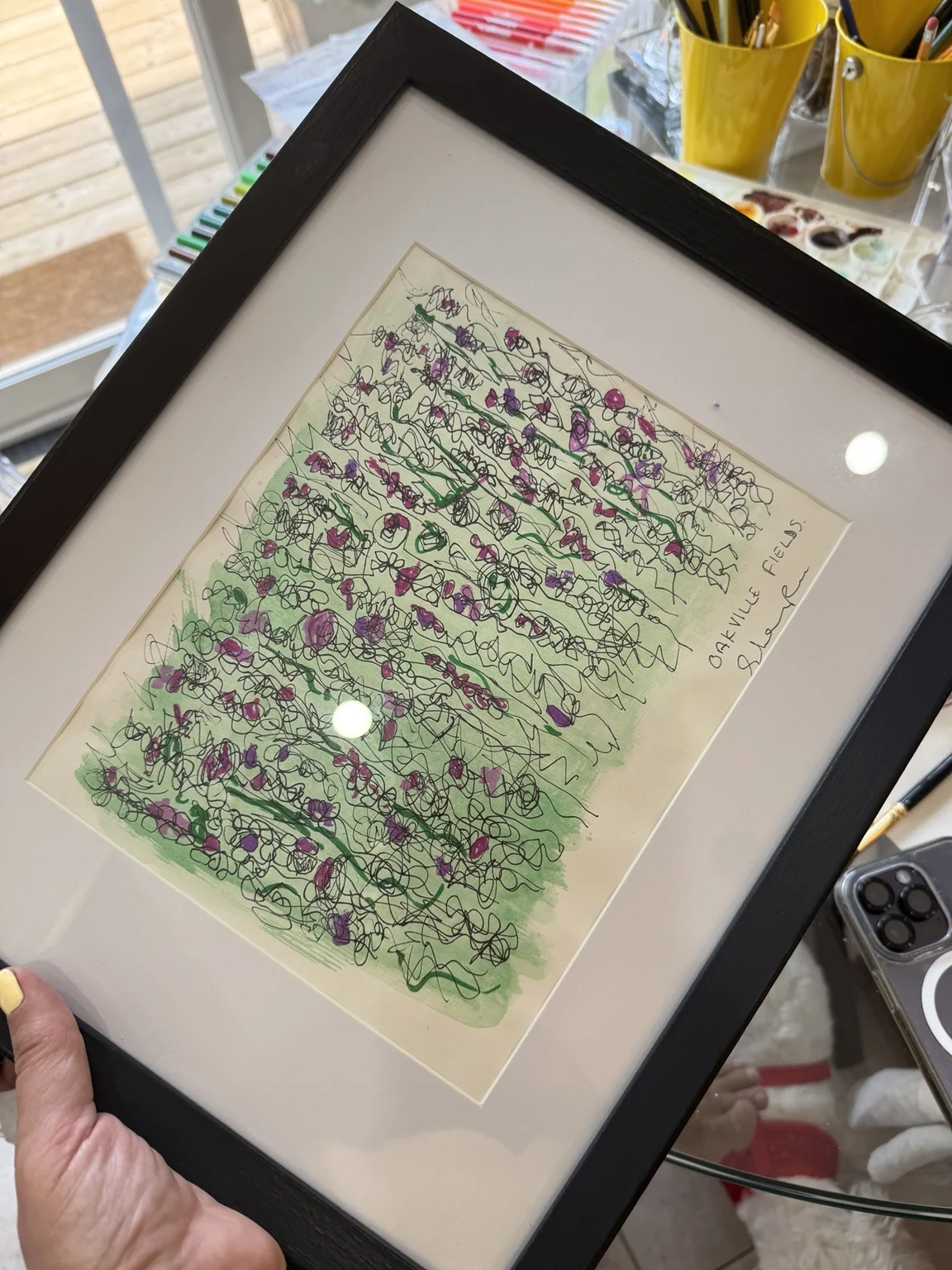 The green ink work in a frame.