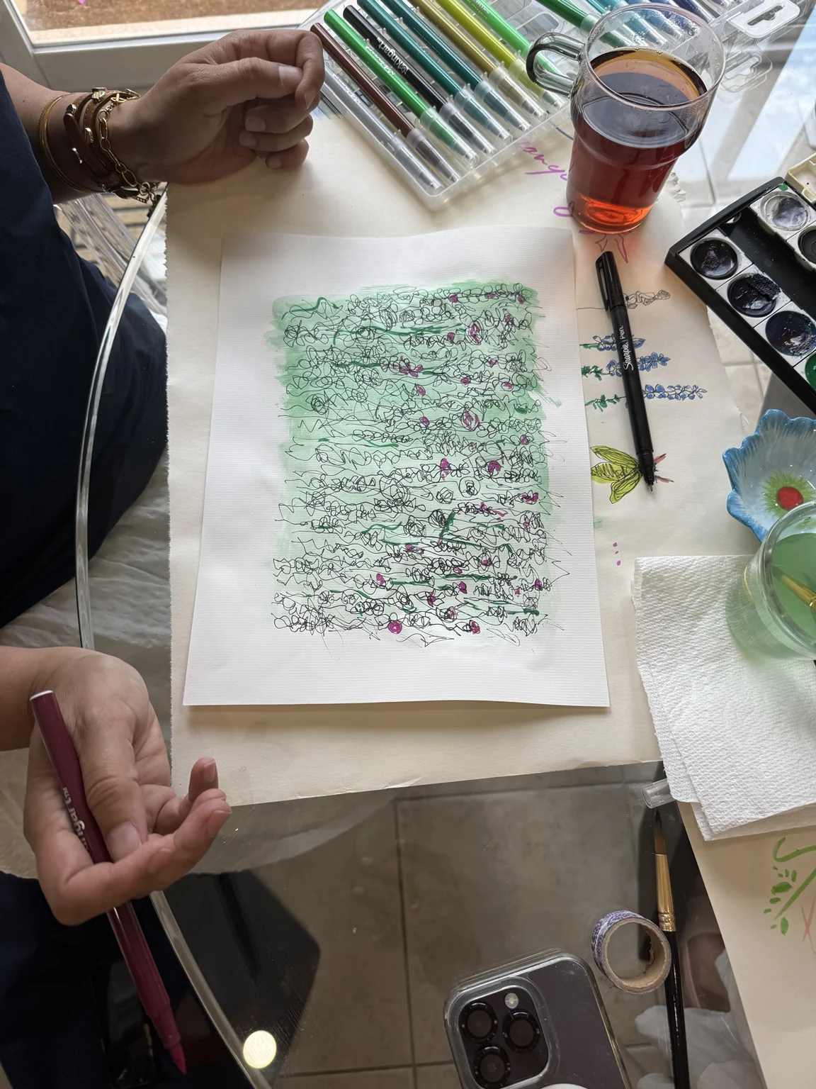 Green washes and fine ink marks at the table.