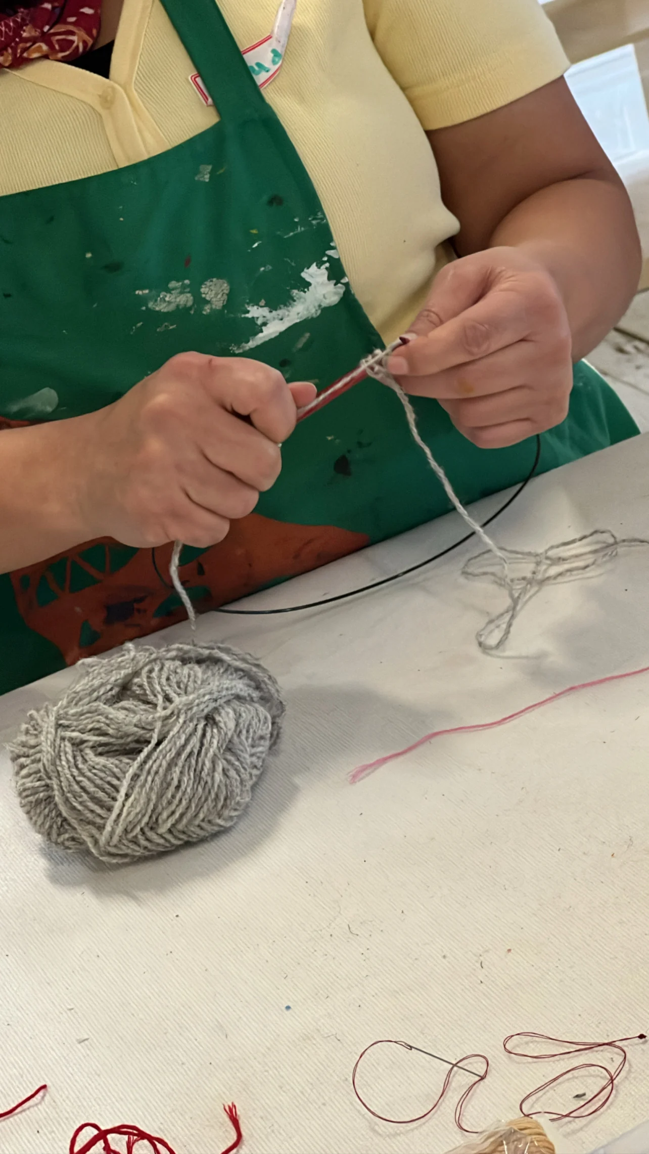 Working with grey yarn.